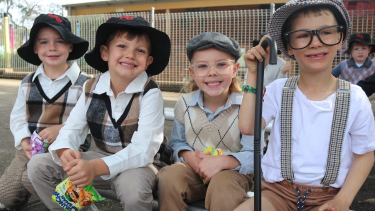 Four students dressed up as if they where 100 years old