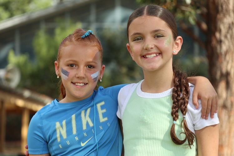 Two students with war paint on their checks